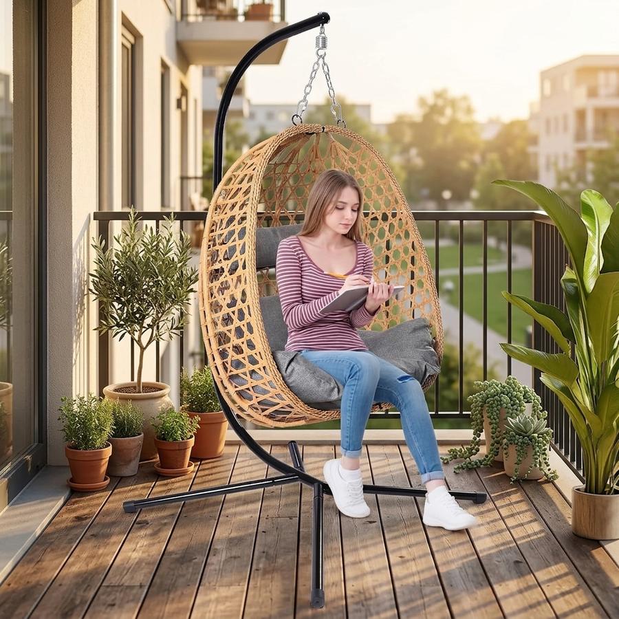 DoubleTT Patio Wicker Egg Chair, Yellow and Green, on a porch